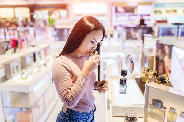 picture of a woman shopping for perfume